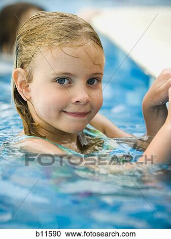 Stock Image - Girl in a swimming pool. Fotosearch