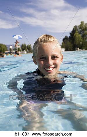 Girl in a swimming pool View Large Photo Image Stock Photo - Girl in a swimming pool. Fotosearch