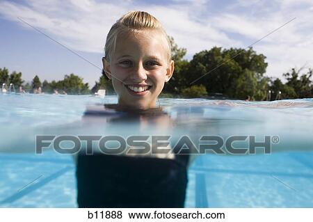 Girl in a swimming pool View Large Photo Image Stock Photo - Girl in a swimming pool. Fotosearch