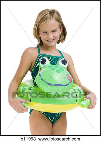 Girl in bathing suit with swim ring View Large Photo Image Stock Photo - Girl in bathing suit with swim ring. Fotosearch