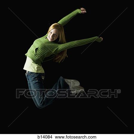 Girl leaping and smiling View Large Photo Image Picture - Girl leaping and smiling. Fotosearch