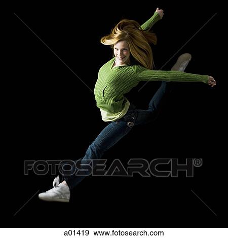 Girl leaping and smiling View Large Photo Image Stock Photo - Girl leaping and smiling. Fotosearch