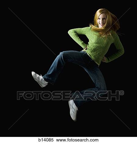 Girl leaping and smiling View Large Photo Image Stock Photography - Girl leaping and smiling. Fotosearch