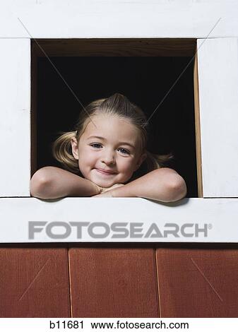 Girl looking out window of playhouse View Large Photo Image Stock Image - Girl looking out window of playhouse. Fotosearch