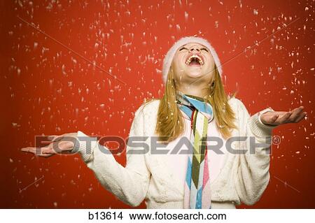Girl looking up at snow View Large Photo Image Picture - Girl looking up at snow. Fotosearch