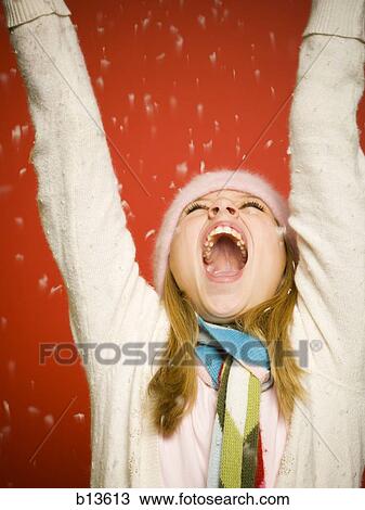 Girl looking up at snow View Large Photo Image Stock Image - Girl looking up at snow. Fotosearch