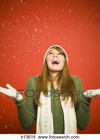 Girl looking up at snow View Large Photo Image Stock Photography - Girl looking up at snow. Fotosearch