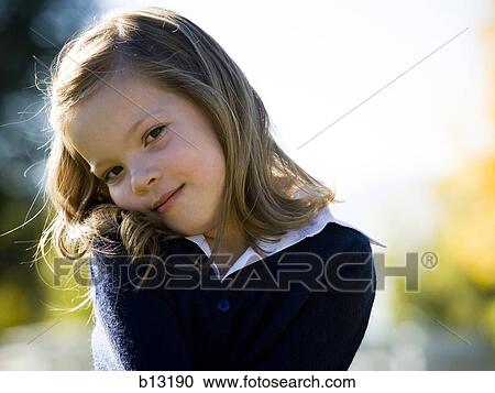 Girl posing outdoors View Large Photo Image Stock Image - Girl posing outdoors. Fotosearch