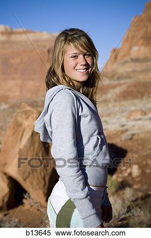 Girl posing outdoors with rock formations View Large Photo Image Stock Photography - Girl posing outdoors with rock formations. Fotosearch