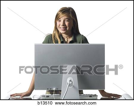 Girl with braces standing behind computer monitor View Large Photo Image Stock Image - Girl with braces standing behind computer monitor. Fotosearch