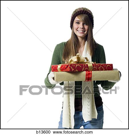 Girl with Christmas gifts smiling View Large Photo Image Stock Image - Girl with Christmas gifts smiling. Fotosearch