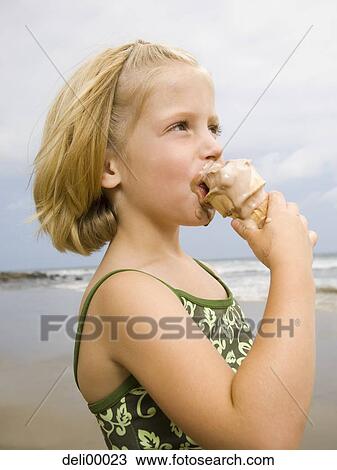 Girl with Ice Cream Cone at the beach View Large Photo Image Stock Image - Girl with Ice Cream Cone at the beach. Fotosearch