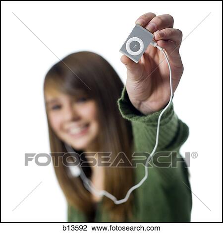 Stock Image - Girl with mp3 player. Fotosearch