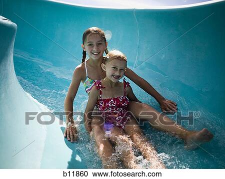 Girls on a waterslide View Large Photo Image Stock Image - Girls on a waterslide. Fotosearch