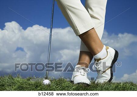 Stock Photo - Golfer resting on club. Fotosearch