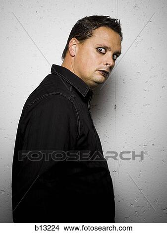 Gothic man with eyeliner and lipstick View Large Photo Image Picture - Gothic man with eyeliner and lipstick. Fotosearch