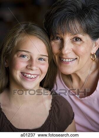Grandmother and daughter smiling with braces View Large Photo Image Stock Photo - Grandmother and daughter smiling with braces. Fotosearch