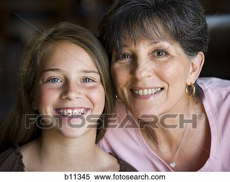 Grandmother and daughter smiling with braces View Large Photo Image Stock Photography - Grandmother and daughter smiling with braces. Fotosearch