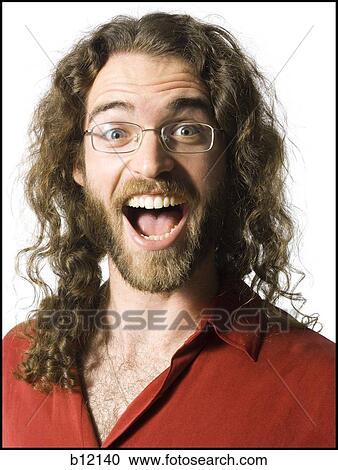 Stock Image - Happy man with long hair and beard. Fotosearch