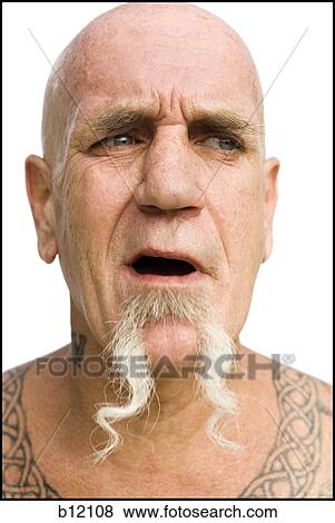 Stock Photo - Heavily tattooed man smiling. Fotosearch