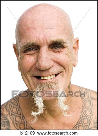 Stock Photo - Heavily tattooed man smiling. Fotosearch