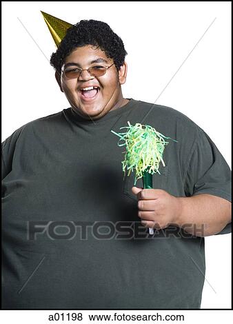 Heavyset young man celebrating birthday View Large Photo Image Stock Photo - Heavyset young man celebrating birthday. Fotosearch