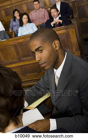 High angle view of a male lawyer in a courtroom during a trial View Large Photo Image Stock Photo - High angle view of a male lawyer in a courtroom during a trial. Fotosearch