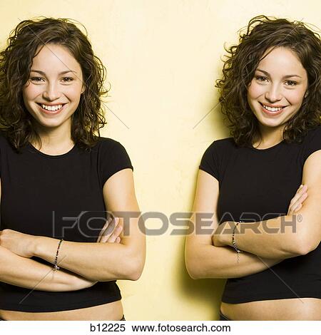 Stock Photography - Identical twin teenage girls. Fotosearch