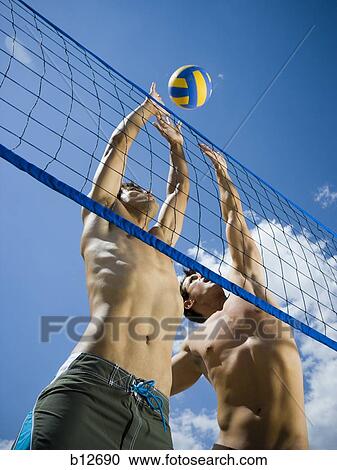 Jumping volleyball players View Large Photo Image Stock Image - Jumping volleyball players. Fotosearch