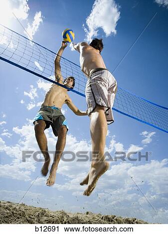 Jumping volleyball players View Large Photo Image Stock Image - Jumping volleyball players. Fotosearch