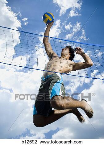 Jumping volleyball players View Large Photo Image Stock Image - Jumping volleyball players. Fotosearch
