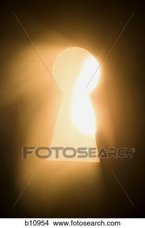Keyhole with bright light beaming through View Large Photo Image Picture - Keyhole with bright light beaming through. Fotosearch