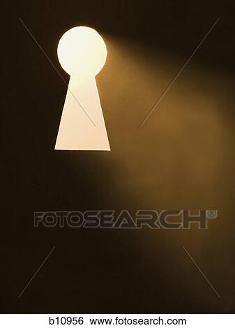 Keyhole with bright light beaming through View Large Photo Image Stock Photograph - Keyhole with bright light beaming through. Fotosearch