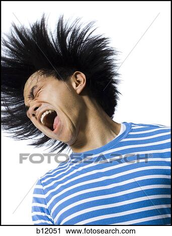 Stock Image - Laughing man with wild hair. Fotosearch