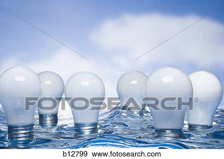 Stock Photo - Light bulbs floating in water. Fotosearch