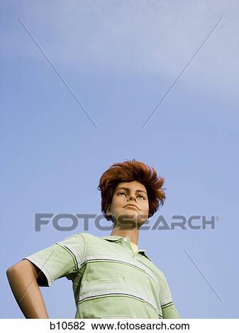 Low angle view of a mannequin portraying a boy View Large Photo Image Stock Image - Low angle view of a mannequin portraying a boy. Fotosearch