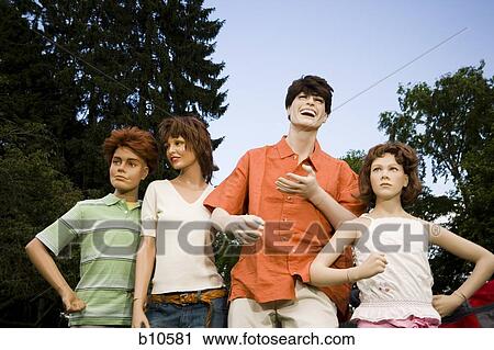 Low angle view of four mannequins portraying a family View Large Photo Image Stock Image - Low angle view of four mannequins portraying a family. Fotosearch