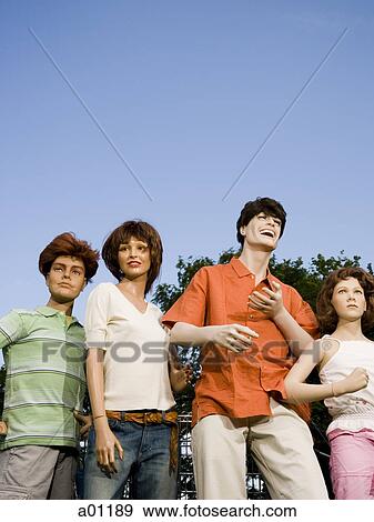 Low angle view of four mannequins portraying a family View Large Photo Image Stock Photo - Low angle view of four mannequins portraying a family. Fotosearch
