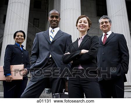 Low angle view of lawyers in front of a courthouse View Large Photo Image Stock Image - Low angle view of lawyers in front of a courthouse. Fotosearch