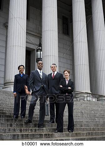 Low angle view of lawyers standing on the steps of a courthouse View Large Photo Image Stock Image - Low angle view of lawyers standing on the steps of a courthouse. Fotosearch