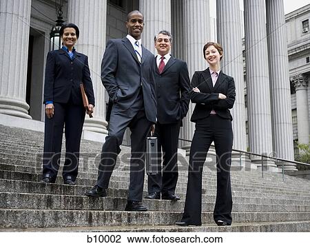 Low angle view of lawyers standing on the steps of a courthouse View Large Photo Image Stock Image - Low angle view of lawyers standing on the steps of a courthouse. Fotosearch