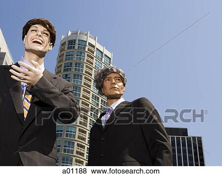 Low angle view of two mannequins portraying businessmen View Large Photo Image Stock Photo - Low angle view of two mannequins portraying businessmen. Fotosearch