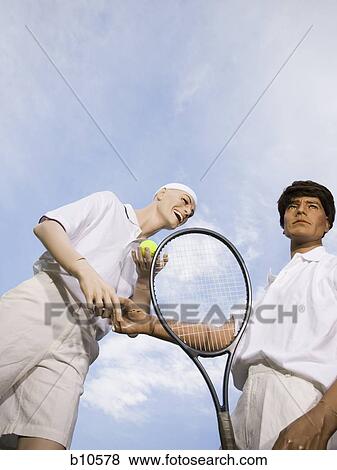 Low angle view of two mannequins portraying tennis players View Large Photo Image Stock Photo - Low angle view of two mannequins portraying tennis players. Fotosearch