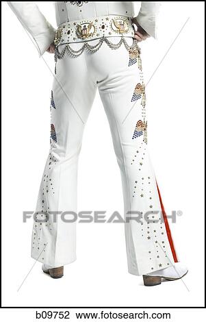 Low section view of a man standing with his hands on his hips View Large Photo Image Stock Image - Low section view of a man standing with his hands on his hips. Fotosearch