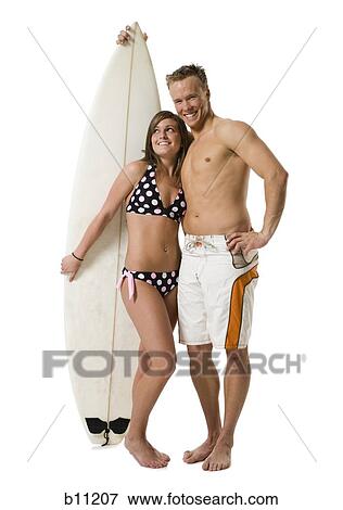 Male and female surfer View Large Photo Image Stock Photo - Male and female surfer. Fotosearch