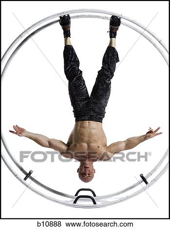 Male bodybuilder posing in German wheel View Large Photo Image Stock Photo - Male bodybuilder posing in German wheel. Fotosearch