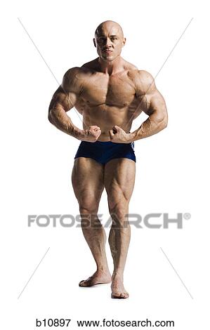 Male bodybuilder posing View Large Photo Image Stock Photo - Male bodybuilder posing. Fotosearch