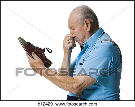 Male bowler sniffing stinky bowling shoes View Large Photo Image Stock Photo - Male bowler sniffing stinky bowling shoes. Fotosearch