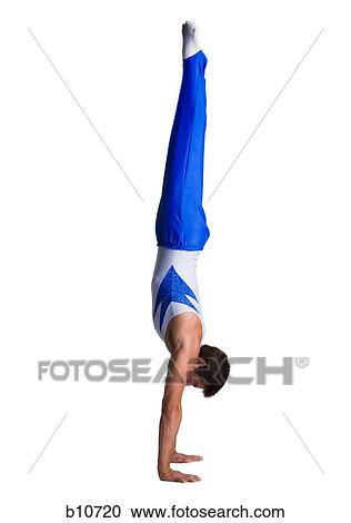 Stock Image - Male gymnast doing floor exercises. Fotosearch