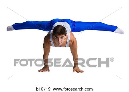 Stock Photo - Male gymnast doing floor exercises. Fotosearch